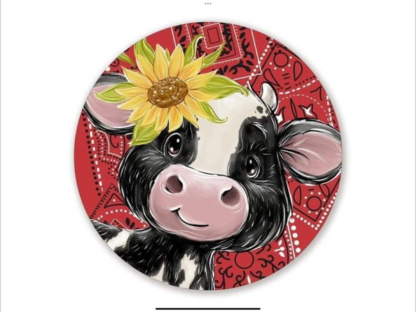 COW WITH RED BACKGROUND WREATH SIGN
